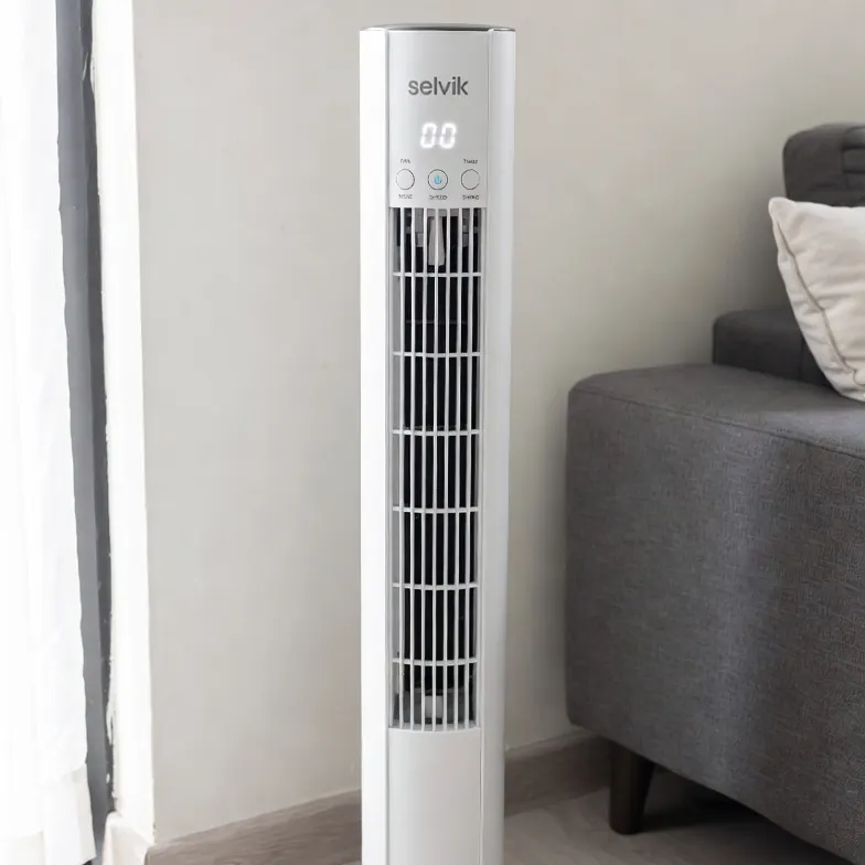 White Selvik tower fan in a living room